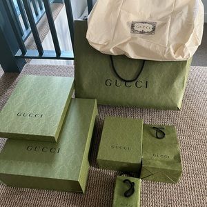 Collection of Gucci 3 gift boxes and bags and 1 canvas Gucci tote bag.